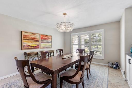 Sunlit main-level dining roomâperfect for gathering and entertaining.