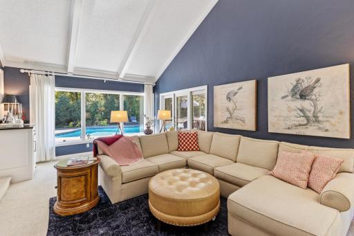 Spacious main-level family room with walk-out access to the screened-in porch.