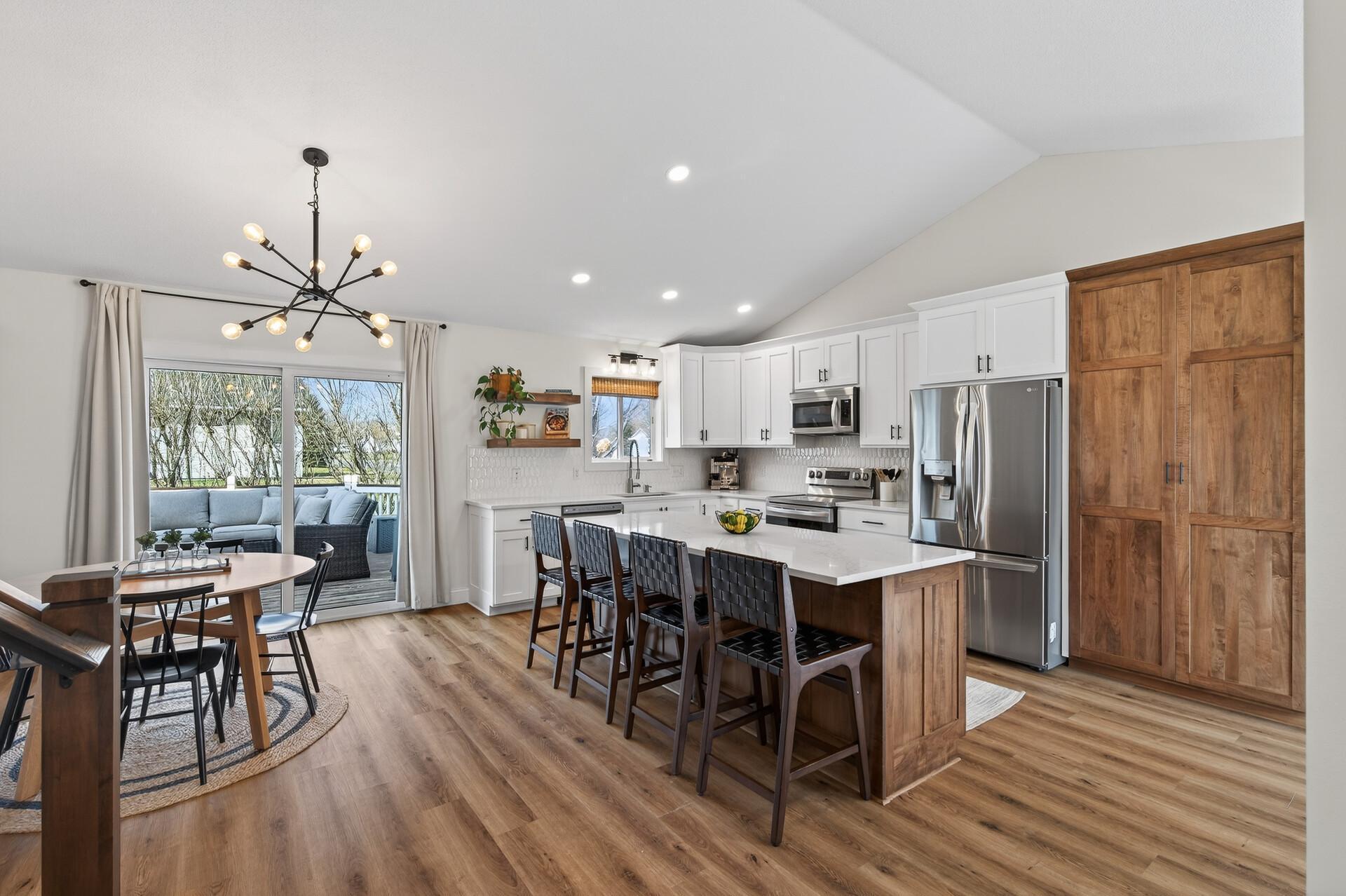 Cozy, Open Kitchen with Amish Built Cabinetry and 8 foot quartz island!