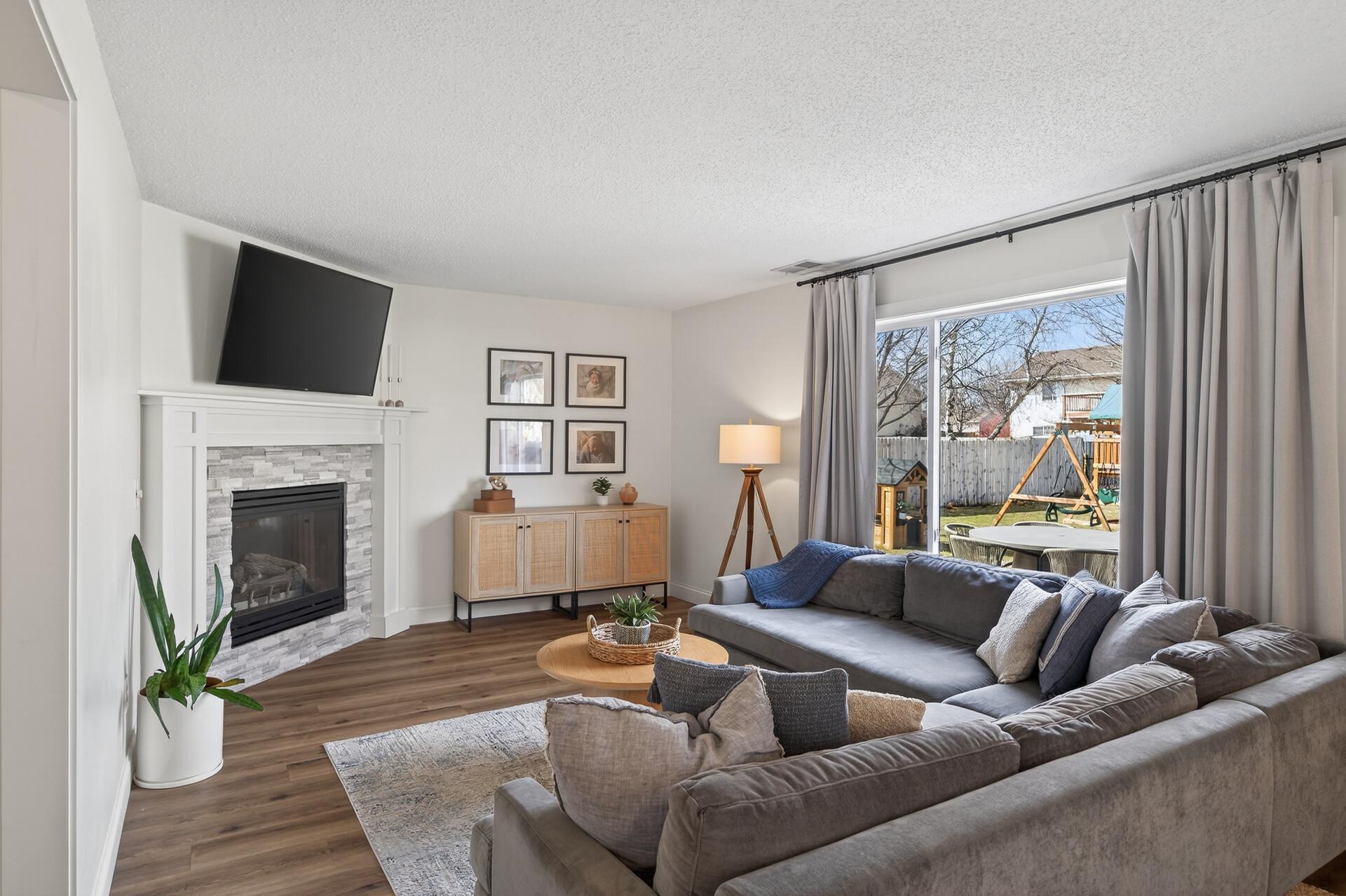 Main Level Living Room with cozy gas burning fireplace.