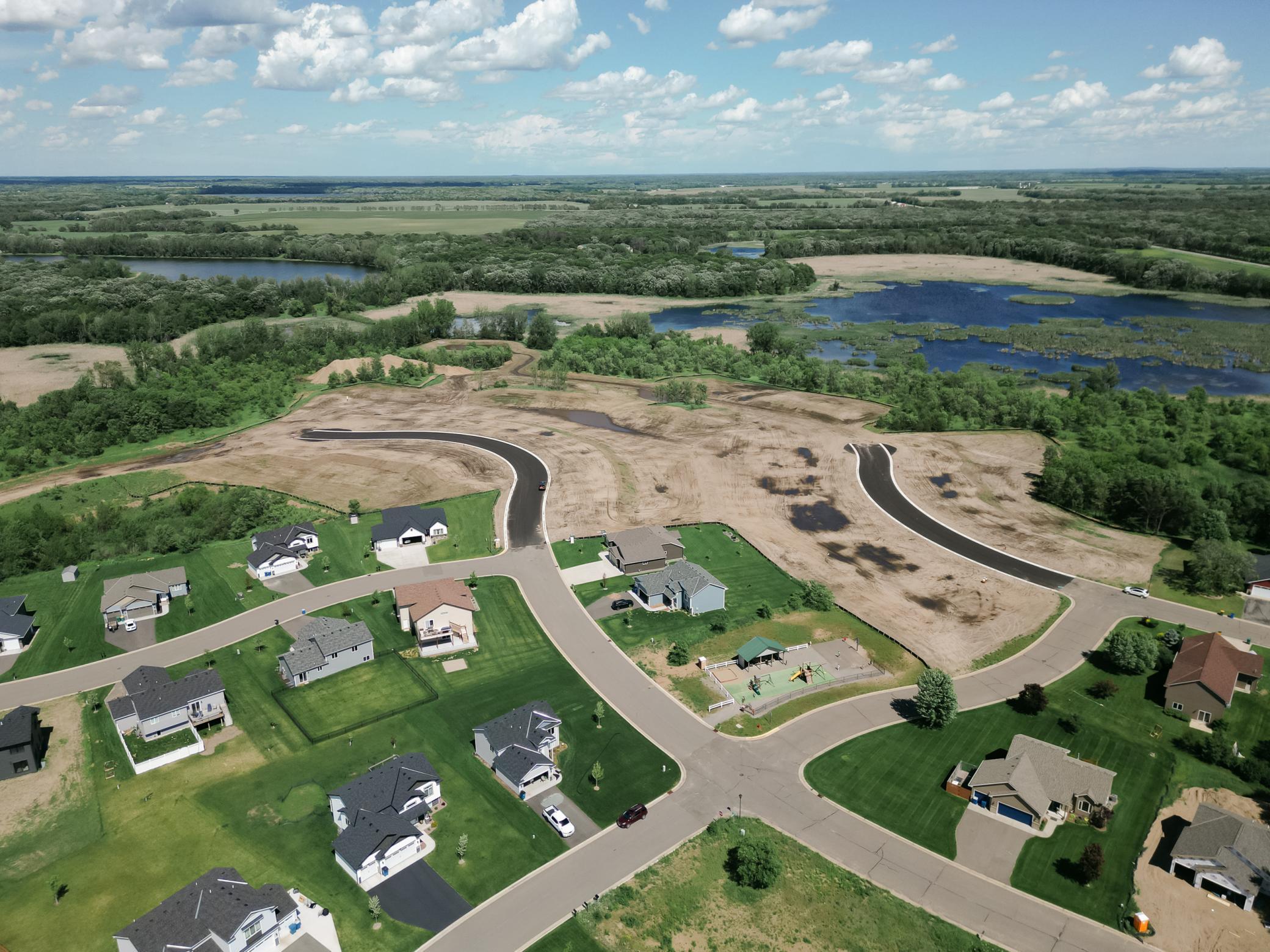New City park, green space, and walking trail to the pond access.
