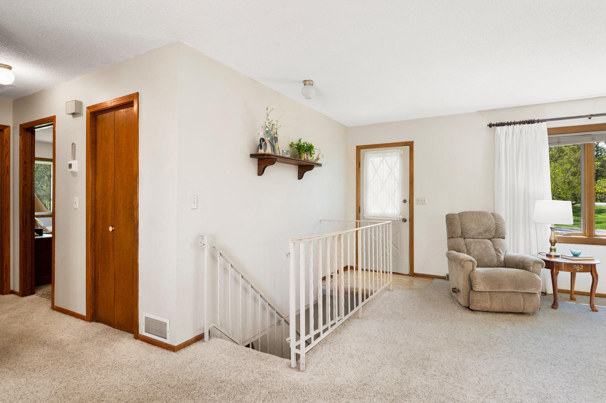 Front entry with open staircase to walkout lower level