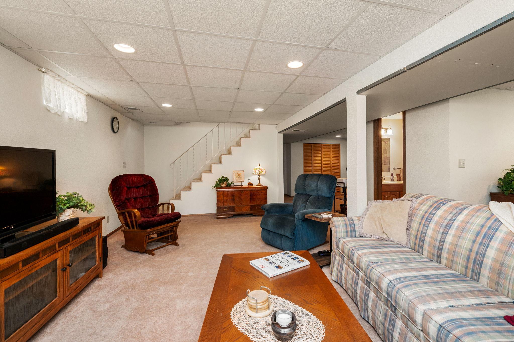 The finished walkout lower level includes a large family room with a cozy gas fireplace
