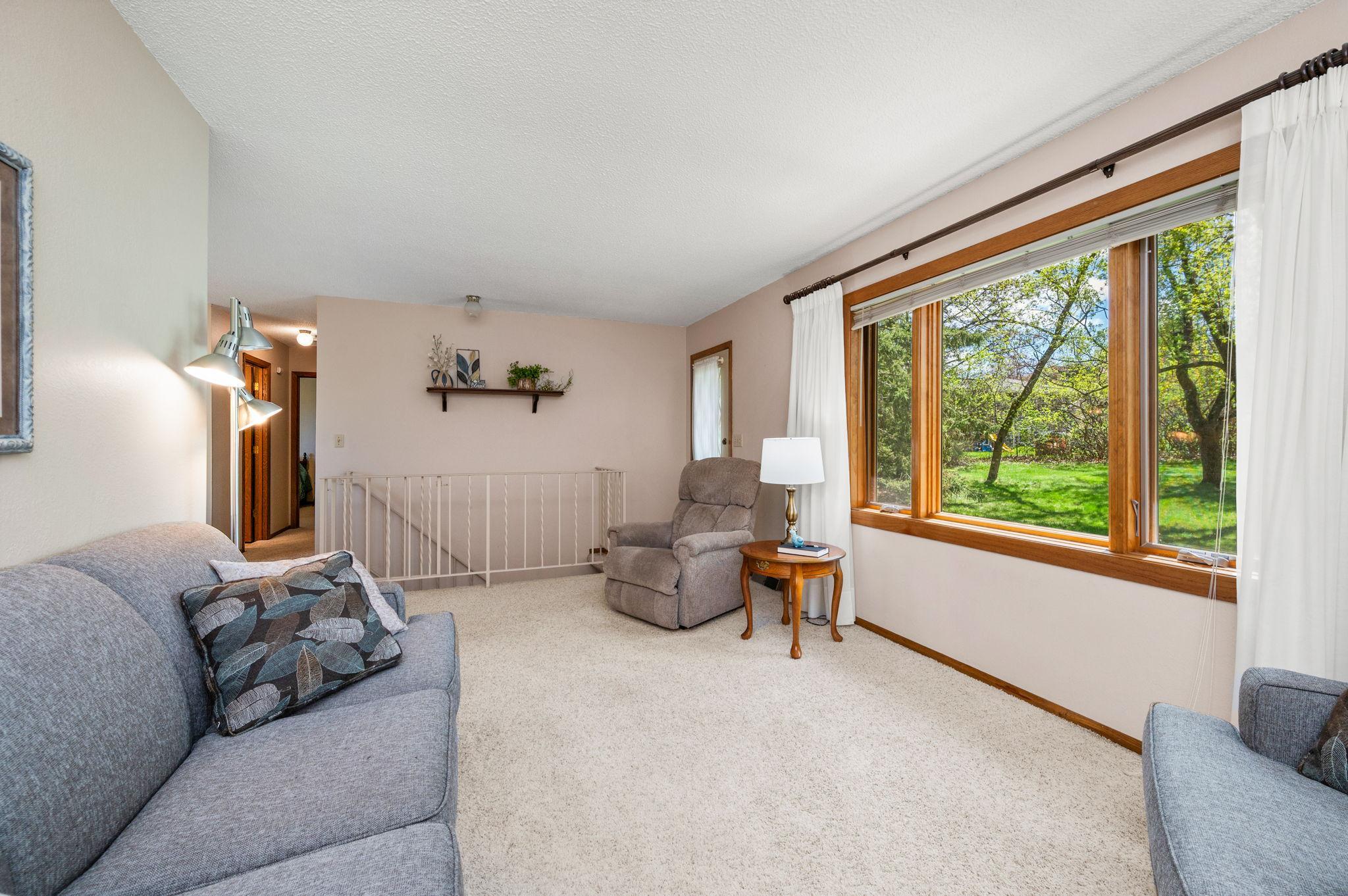 Living Room area with large windows to add nice natural lighting!