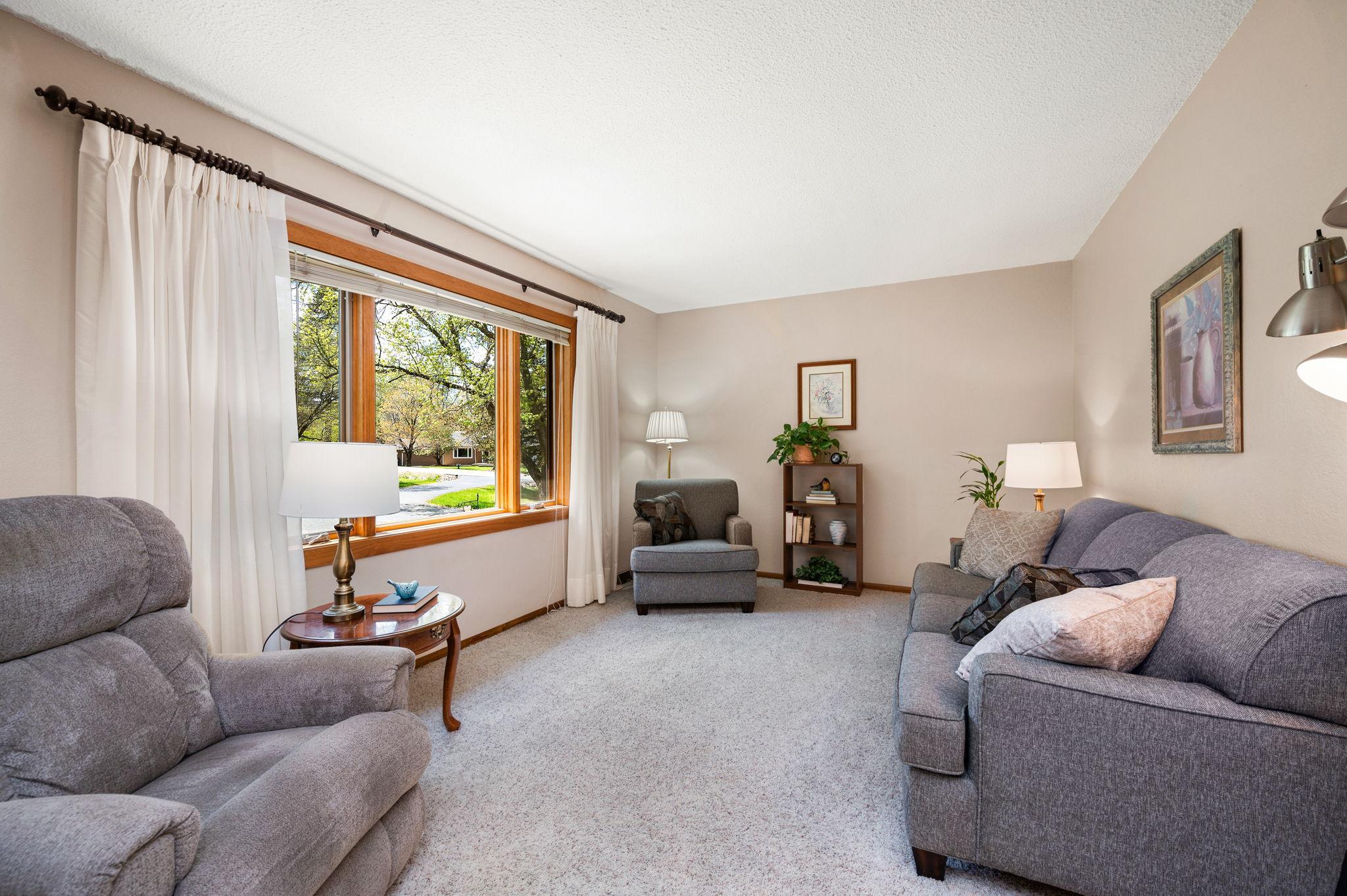 Living Room area with large windows to add nice natural lighting!