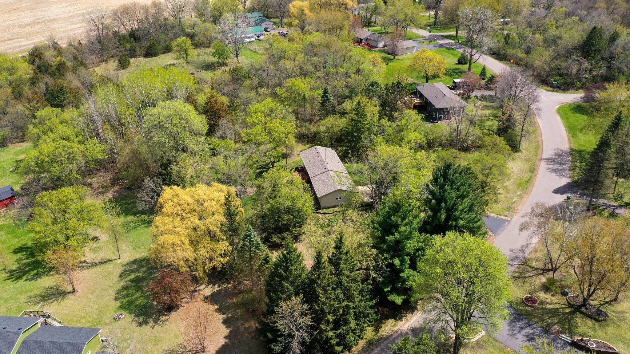 Aerial view of home and private 1+ acre lot!