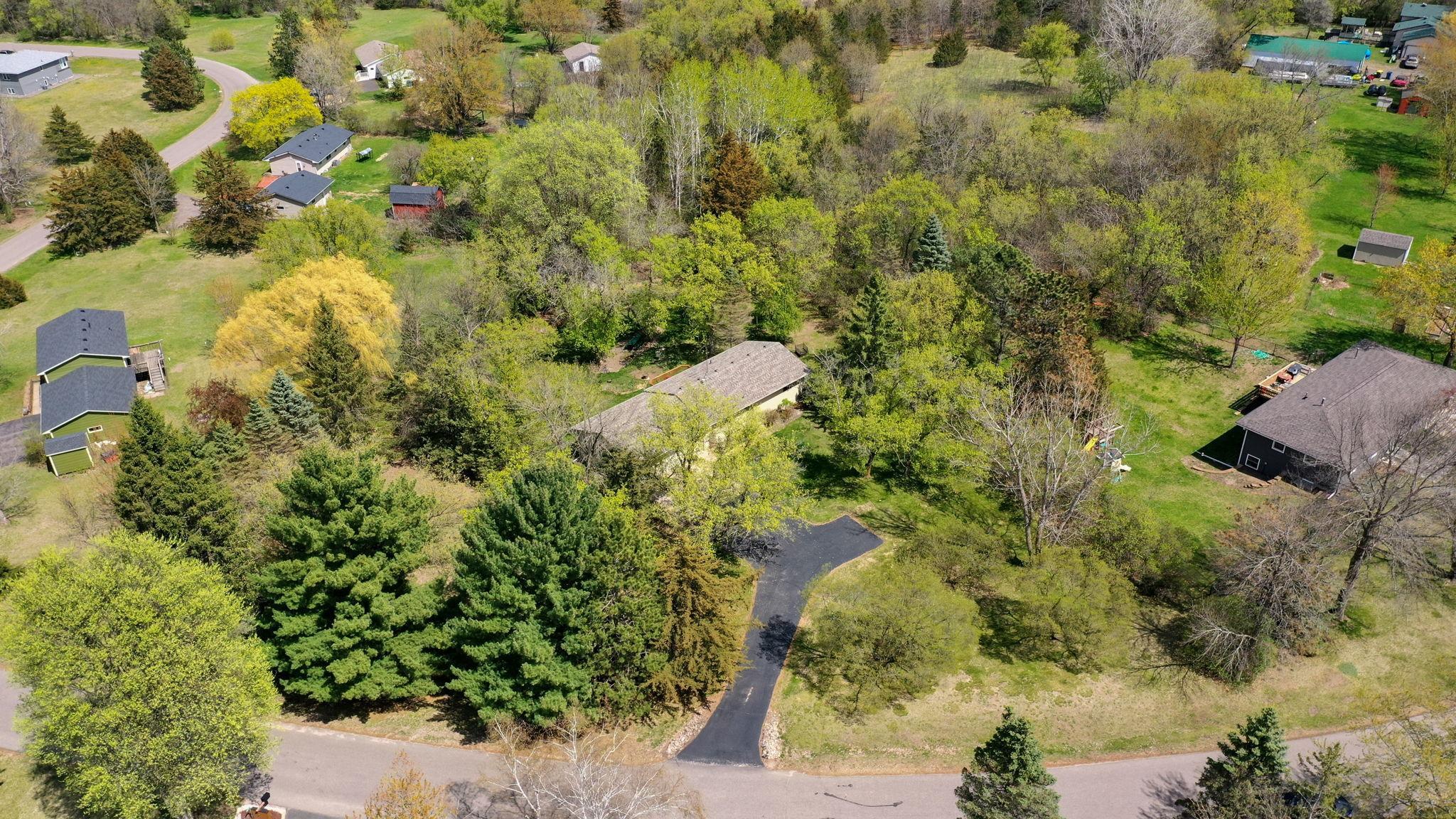 Aerial view of home and private 1+ acre lot!