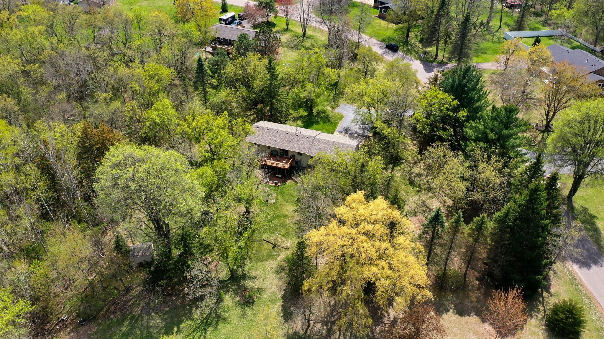 Aerial view of home and private 1+ acre lot!