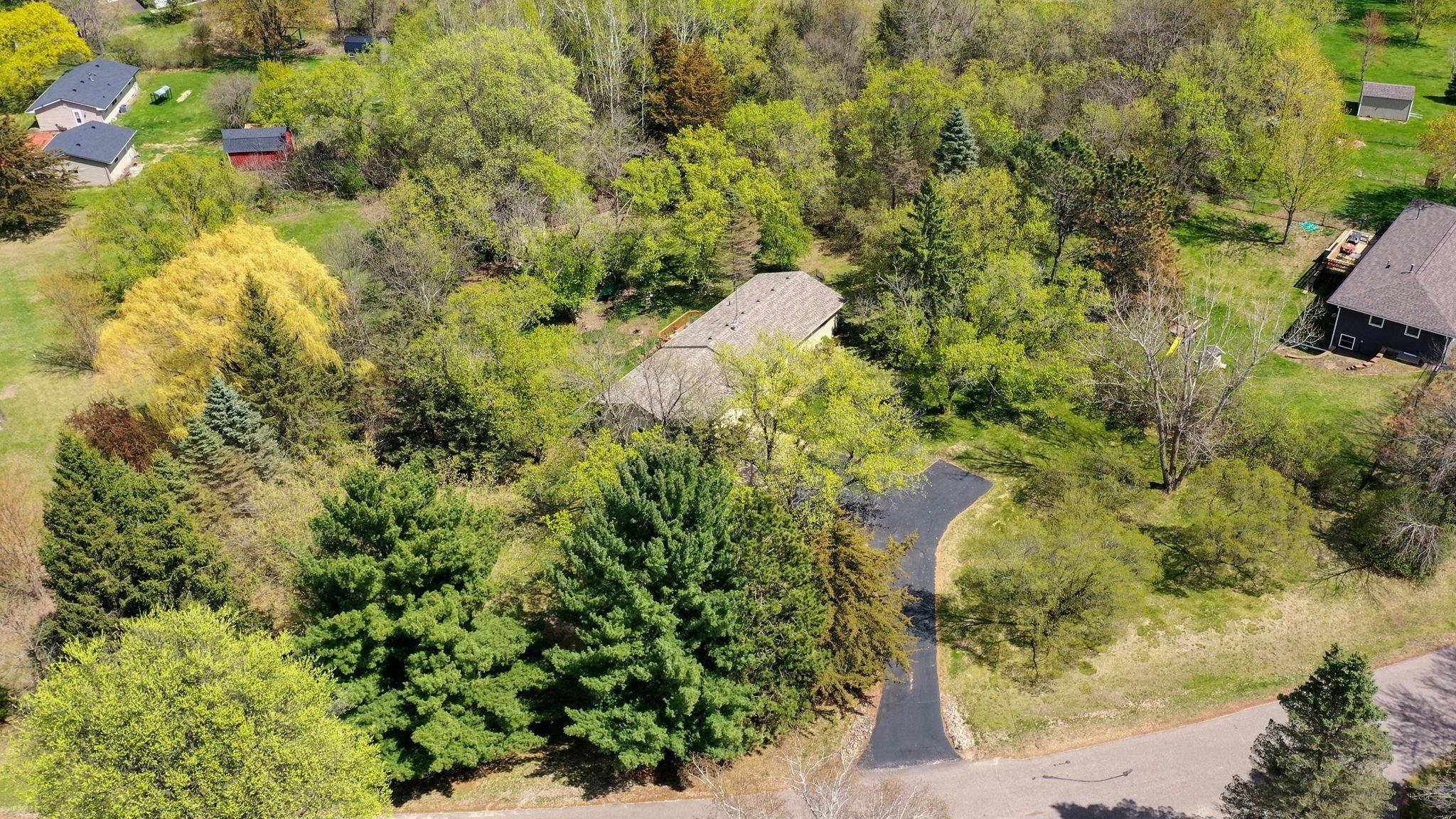 Aerial view of home and private 1+ acre lot!