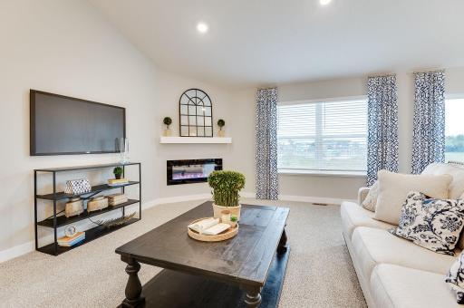 The home's main level living space is loaded with space and can accommodate just about any family room furniture set-up. Photo of model, colors and options will vary.