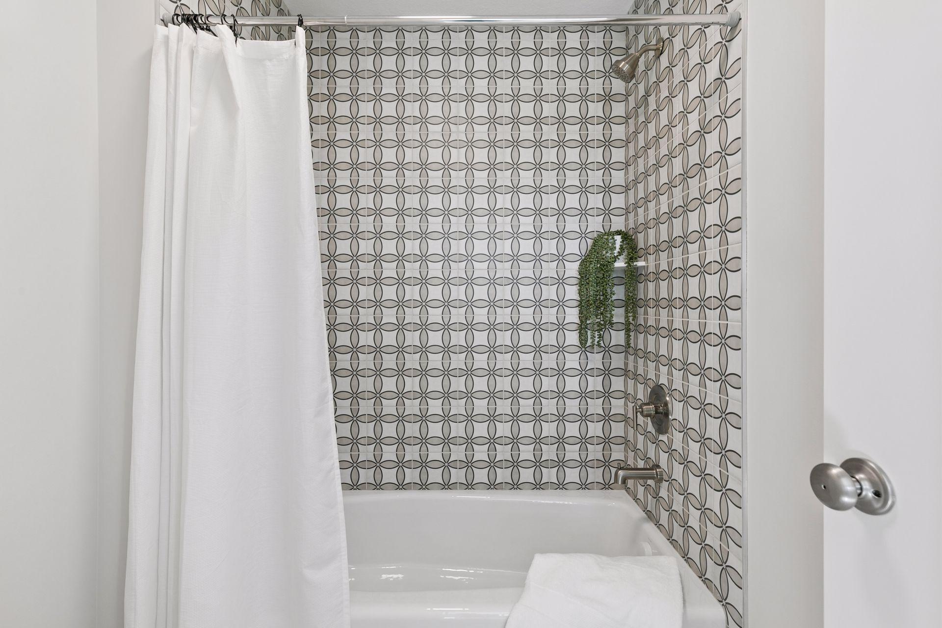 J&J shower with ceramic tile surround