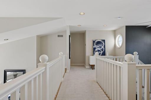 A catwalk separates the two 2nd floor bedrooms, each with their own en suite bathroom.