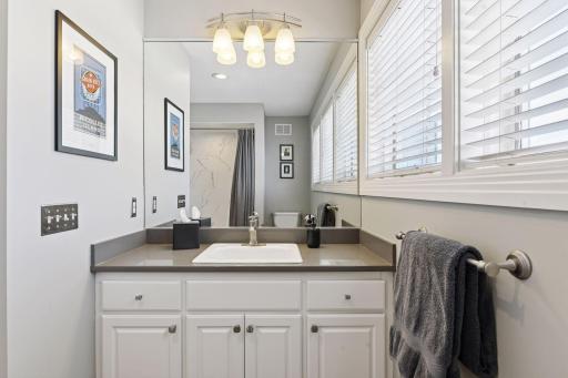 This full bathroom en suite was also recently updated and serves the second bedroom upstairs.
