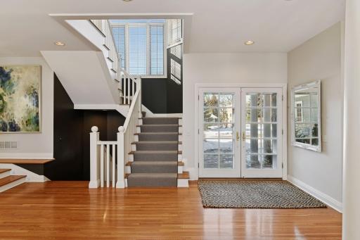 The main entrance foyer serves as the central connector to nearly all areas in the house.
