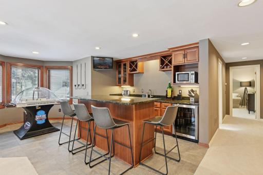 The 4th Bedroom and bath is located down the hall from wet bar and games area.