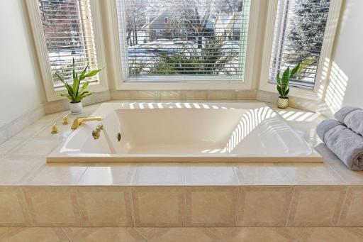 A two-person jet/soaking tub anchors the Primary Bathroom.