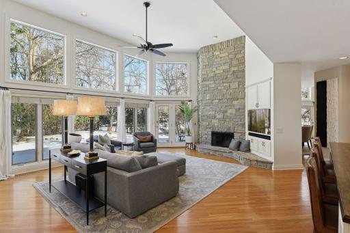 A wood burning fireplace anchors the Family Room which is open to the kitchen (at right).