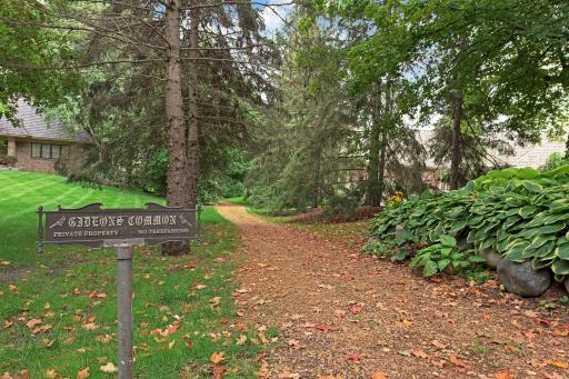 Across the street from the back of the house is the HOA's path to Gideon's Commons, where the homeowners' deeded dock and boat slip are located