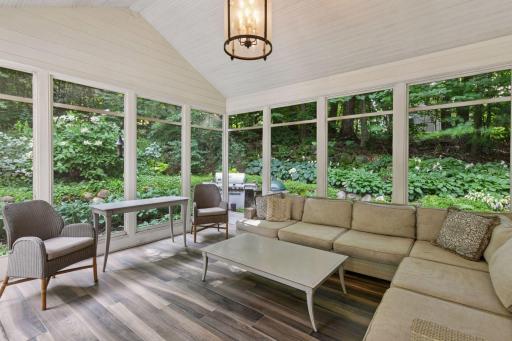 Screened porch opens to the patio and backyard