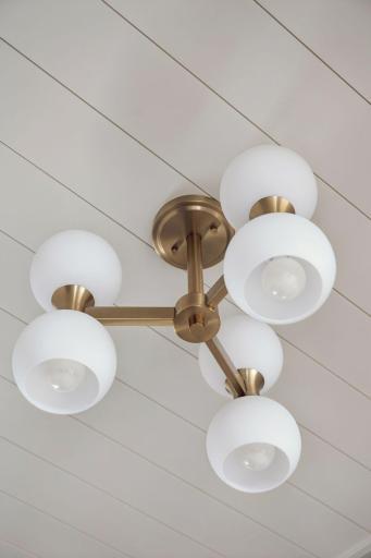 Shiplap Accent in Foyer with Decorative Lighting