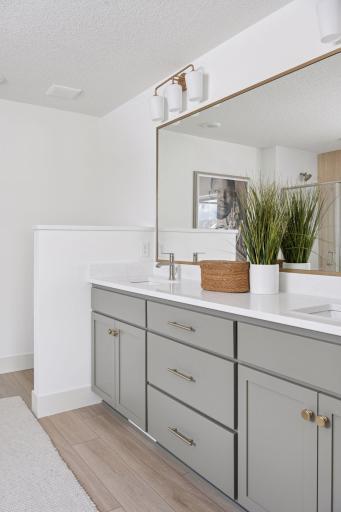Primary Bathroom with Large Mirror over Vanity