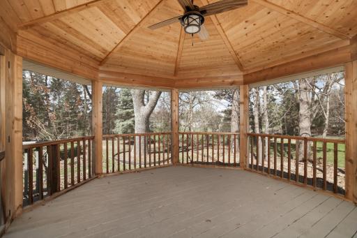 Custom built hexagon enclosed screen porch just off the kitchen.
