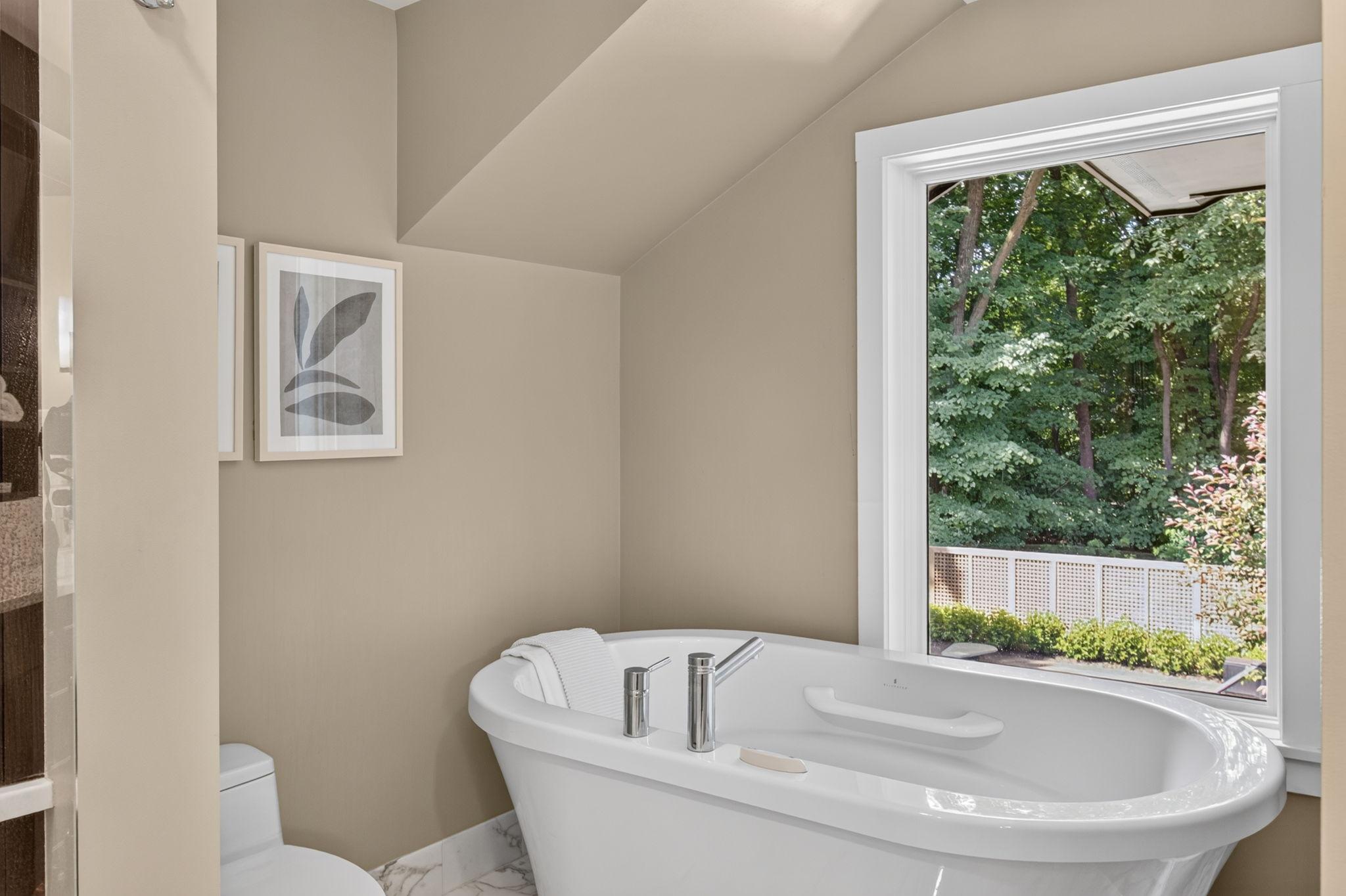 Separate soaking tub in the primary bathroom