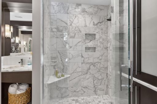 Beautifully tiled walk in shower in the primary bathroom