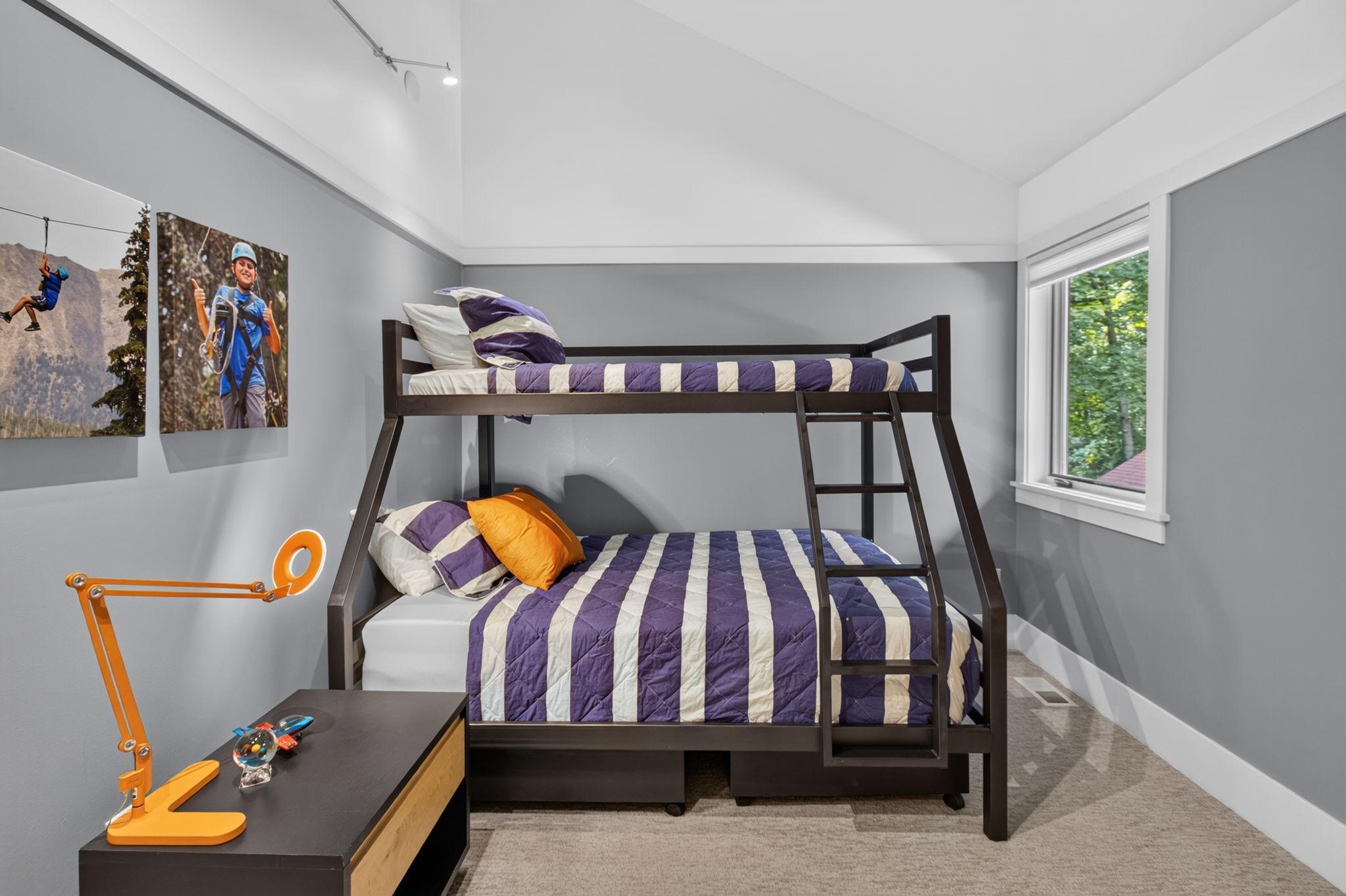 Upper level bedroom with vaulted ceilings