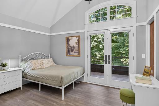 Upper level bedroom with French doors to a private balcony