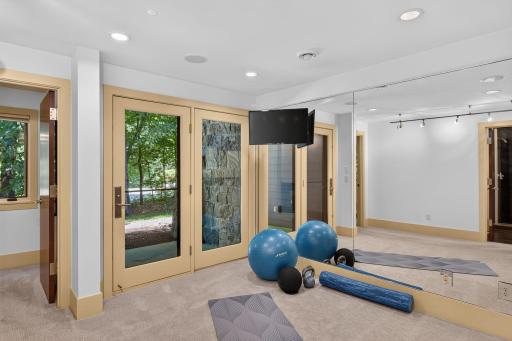 Lower level exercise room that walks out to the side yard