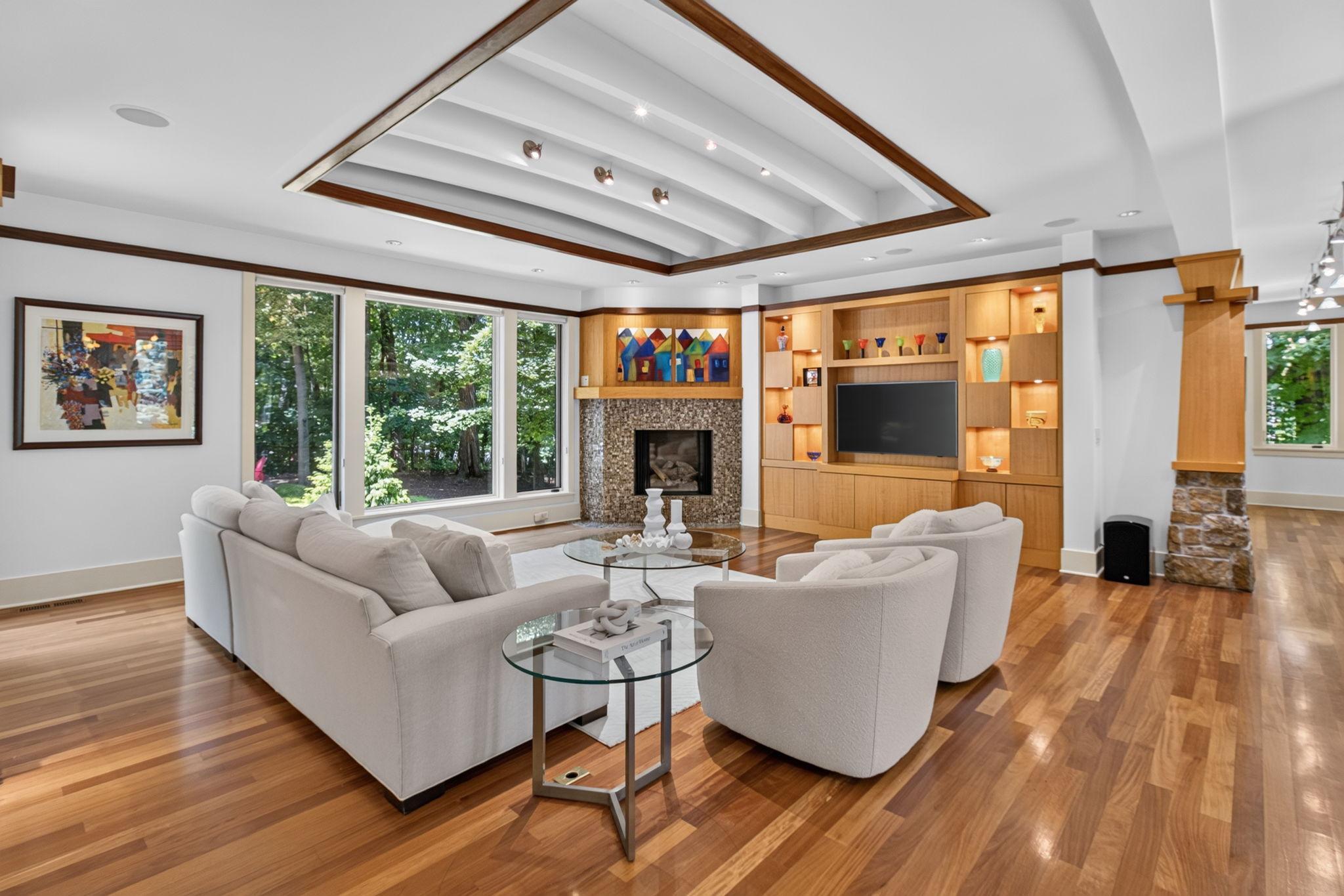 Main level living room with views of the backyard