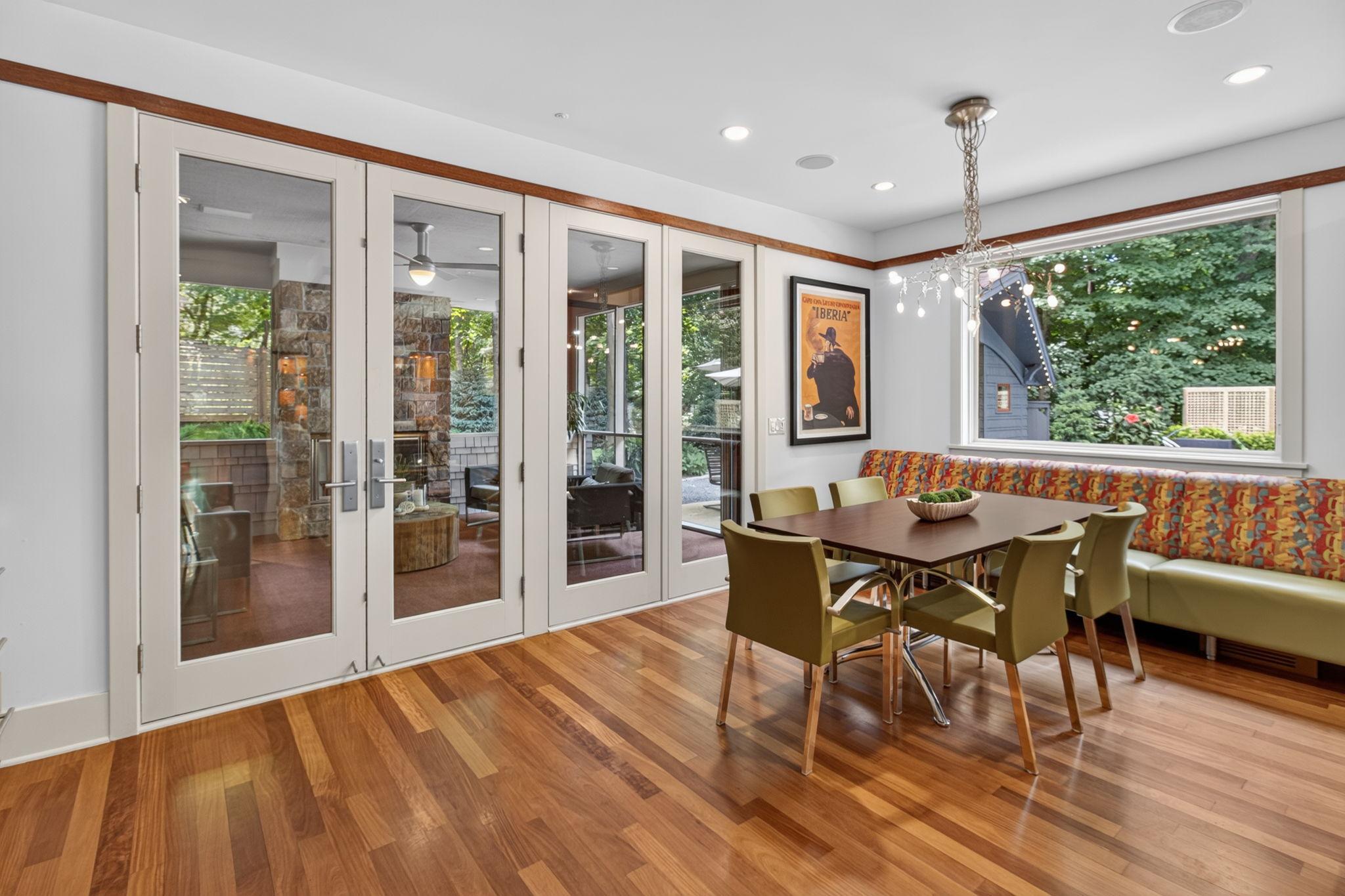Breakfast nook with French doors leading to the 3 seasons porch