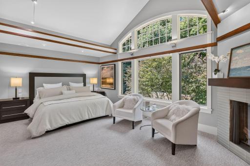 Upper level primary bedroom with abundant natural light