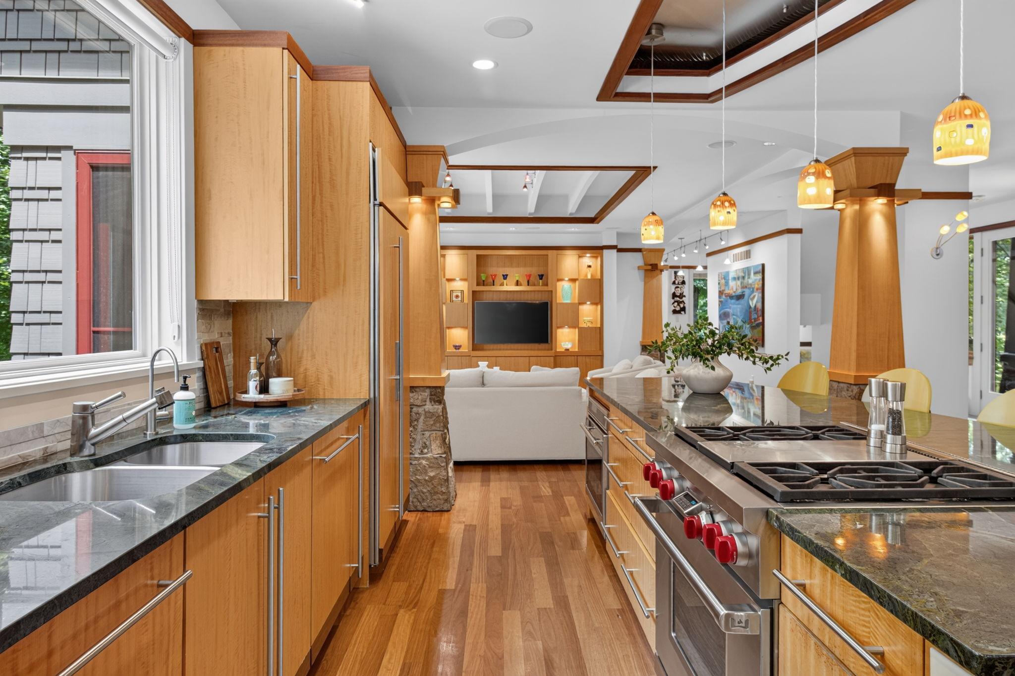 The kitchen features 2 Wolf ranges and 2 dishwashers