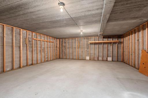 HUGE Storage Space below the entire garage area that can be used for a theatre room, panic room, entertainment area, storage or whatever you wish! Looks like a great floor hockey space to me!!