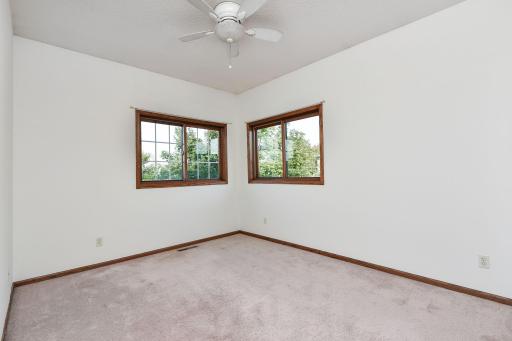2nd bedroom Upper Level with ceiling fan and freshly painted