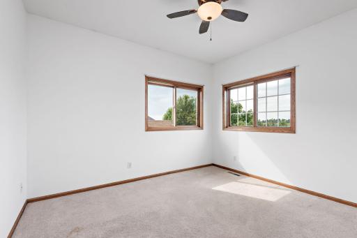 2nd bedroom Upper Level with ceiling fan and freshly painted