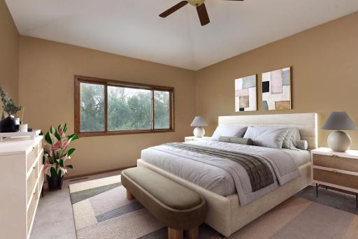 Primary/Owners Suite with River Views, vaulted ceilings, walk-in closet, double vanity, ceiling fan, separate jetted tub and shower and tile surround!