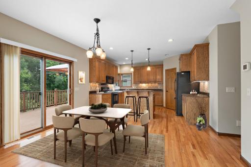 Virtually Staged Dining Room Photo - Step out on to your huge deck and enjoy the river views!