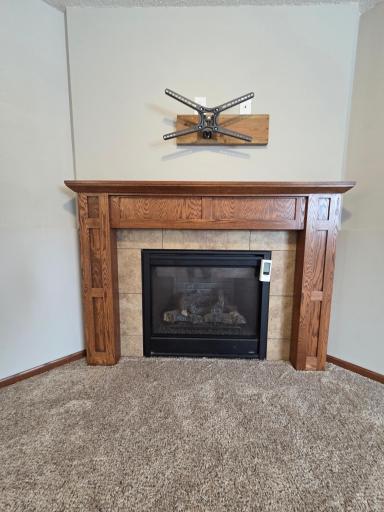 Family room offers cozy gas fireplace, great mantle