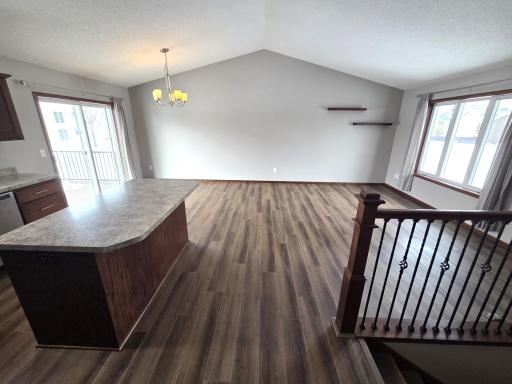 Living room/dining room has large windows/slider