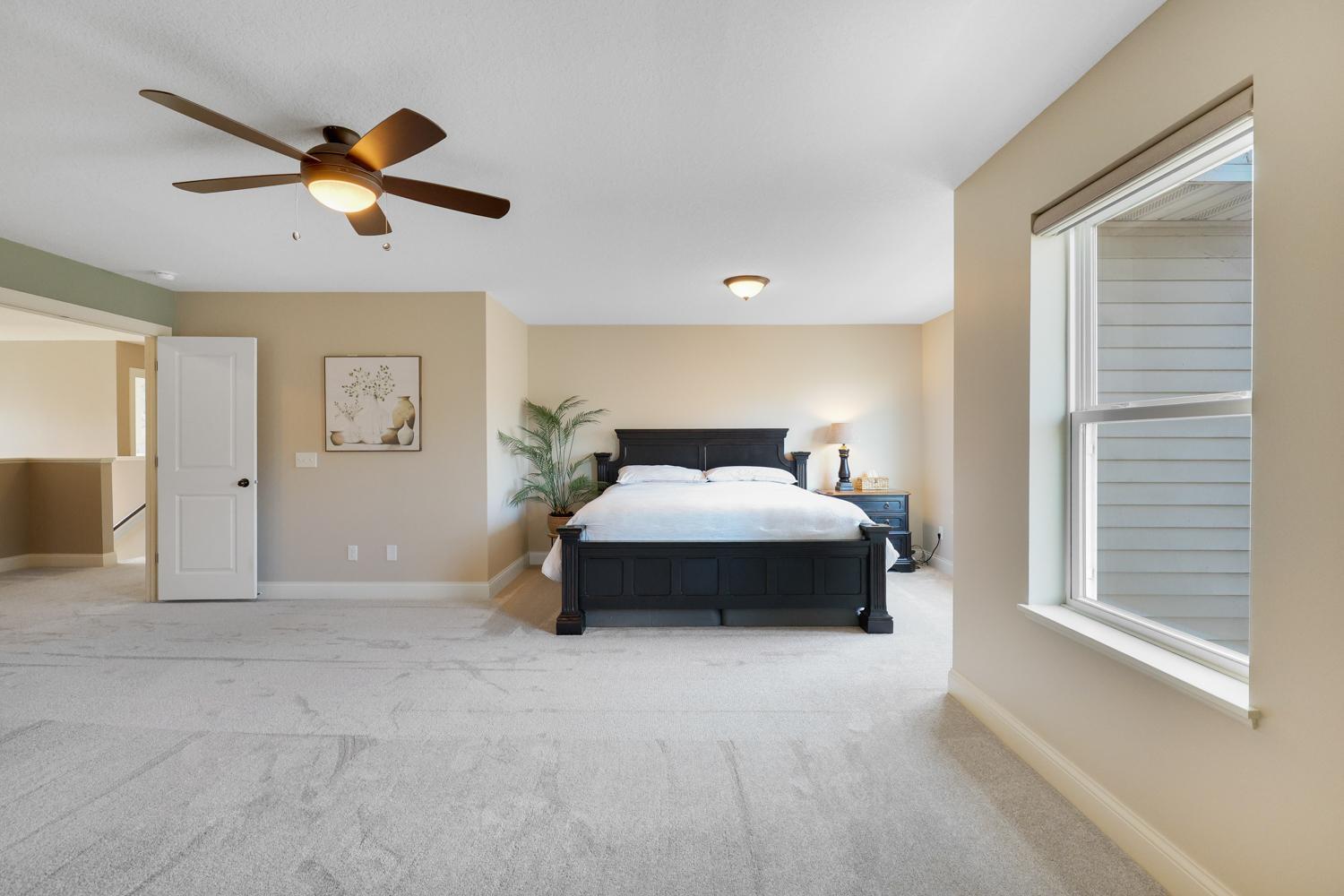 Large primary bedroom with extra windows for all the natural light you could want!