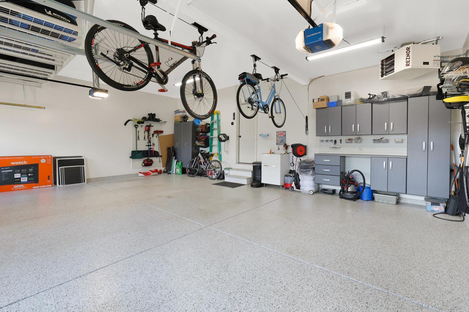 3 car garage with epoxy floors and heated for those cold winter months
