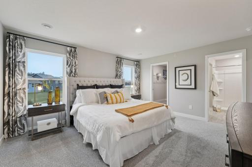 Private primary suite with room for a king size bed, primary bath and walk-in closet. Model photo. Options and colors may vary.