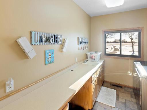 Lots of counter space for folding clothes, crafts, etc. in laundry room