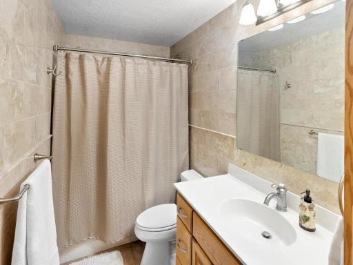 Lower Level full bath with floor to ceiling tile!