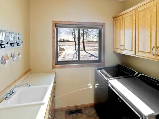 Laundry room conveniently situated off garage entrance on main level