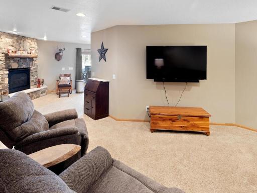 Family room is perfect for cozy nights watching movie by fireplace