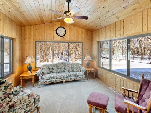 4 Season porch with natural woodwork and vaulted ceiling